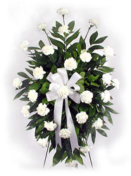 Standing spray of white carnations from Bunn Flowers & Gifts, local florist in Pittsburg, TX