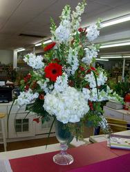 Red and white arrangement in large elegant crystal vase from Bunn Flowers & Gifts, local florist in Pittsburg, TX
