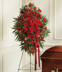 Standing spray of mixed red flowers from Bunn Flowers & Gifts, local florist in Pittsburg, TX