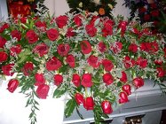 Casket spray of red roses from Bunn Flowers & Gifts, local florist in Pittsburg, TX