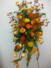 Standing spray of assorted seasonal and tropical flowers from Bunn Flowers & Gifts, local florist in Pittsburg, TX